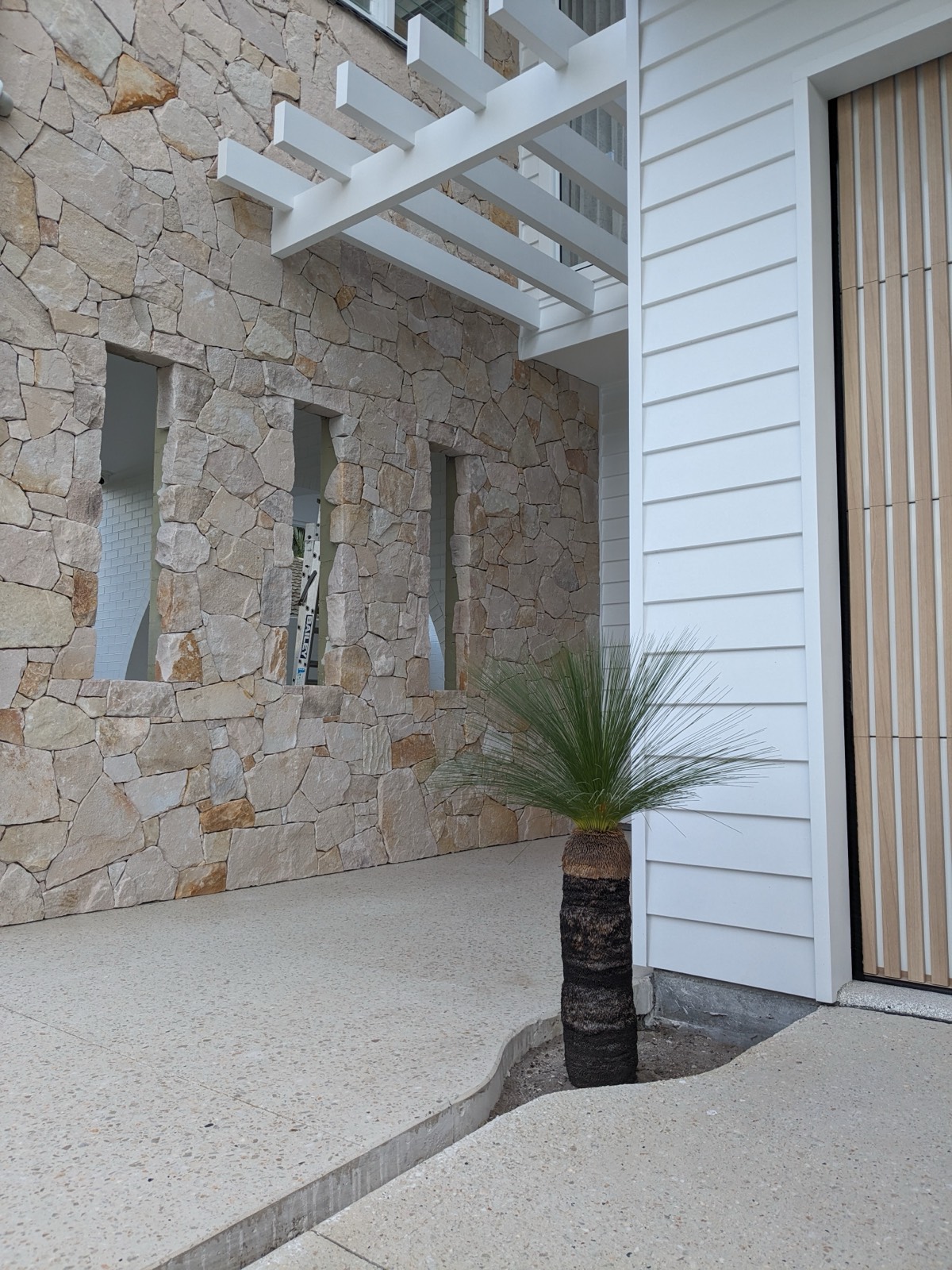 Close-up of dry-stacked grey stone cladding
